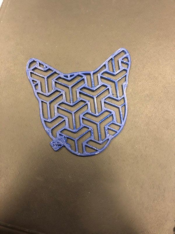 3D printed coaster in the shape of a cat head